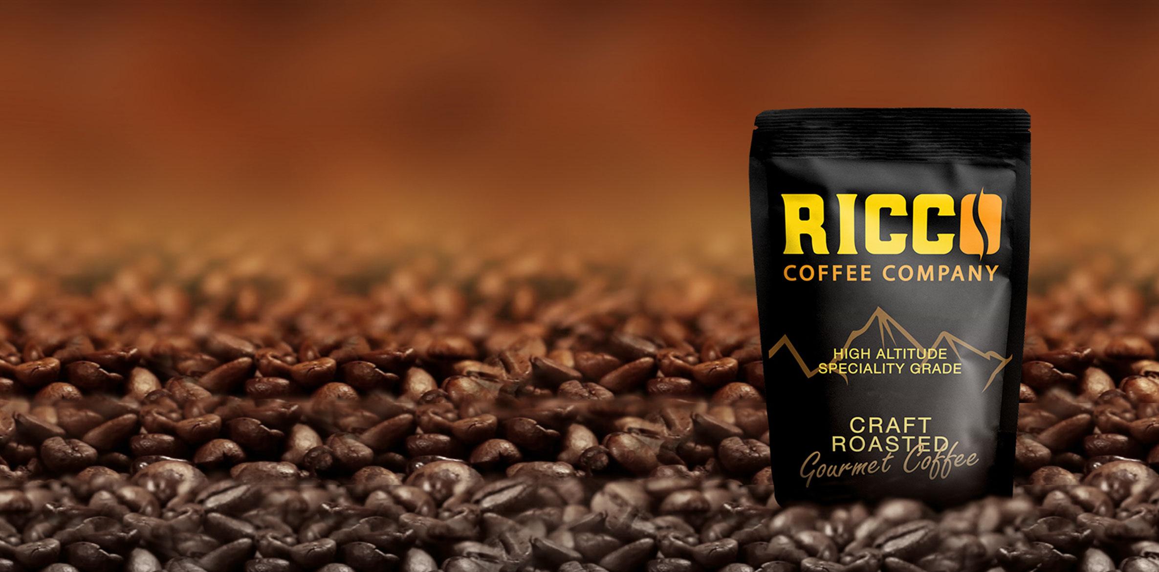 Ricco Coffee Company – Craft Roasted Gourmet Coffee Banner Homepage banner for Ricco Coffee Company featuring a craft roasted gourmet coffee bag on a bed of specialty-grade coffee beans
